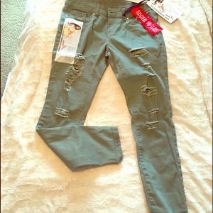 Pale green rip skinny jeans